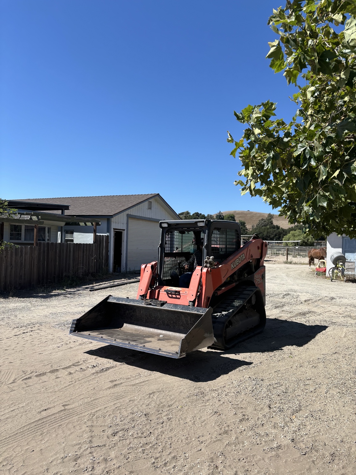 Track loader at a rural property
